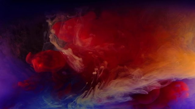 Color paint drops in water , abstract color mix , drop of Ink color mix paint falling on water Colorful ink in water, 4K footage,