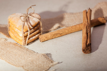 cinnamon and cakes photographed on a light stone background as a symbol of Valentine's Day