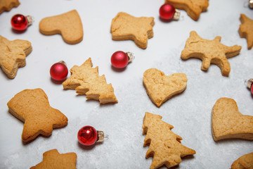 A scattering of Christmas cookies on a gray background. Flat layout. Top view. Christmas and new year concept. Cooking