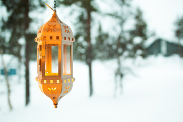 old lantern on a background of snow