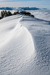 Obraz premium snow drifts on Niederhorn and Mount Stockhorn
