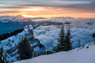 sea of fog in front of Mount Niesen at a winter sunset seen from Niederhorn
