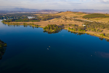 Aerial panoramic view of Lake Burley Griffin looking south toward Molonglo River with kayakers in the waters on a sunny morning 