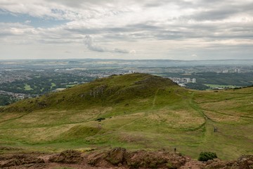 Fototapeta na wymiar Landscape of Edinburgh city in Scotland viewed from Arthurs Seat in cloudy weather