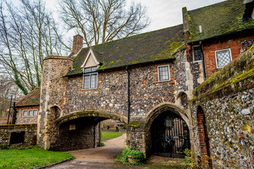Fototapeta na wymiar The ancient flint building of Pulls Ferry in the city of Norwich
