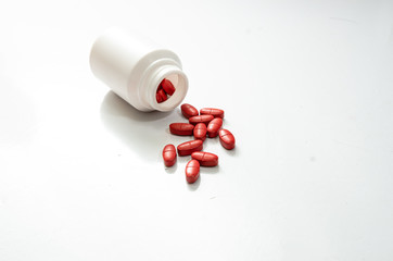 Medical red pills on the White Blackground Soft focus image
