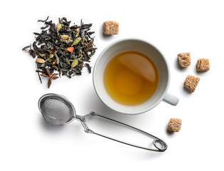 Green tea with natural aromatic additives and accessories. Top view on white background