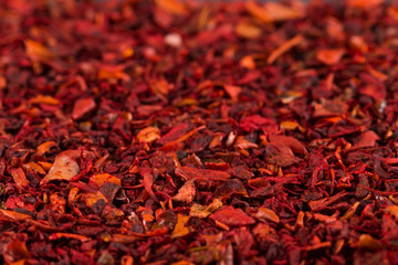 Fototapeta premium Crushed pepper, red background of spices. Copy space.