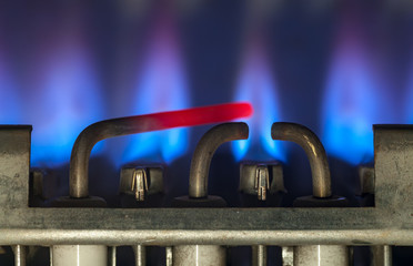 Gas burns in modern water heater. Сloseup. Selective focus.