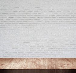 Wooden top board empty table in front of white wall.