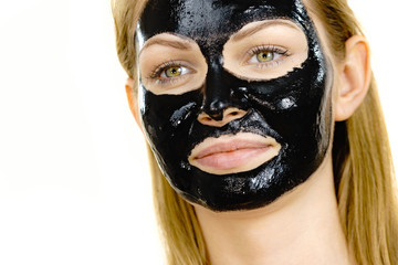 Girl black carbo peel off mask on face