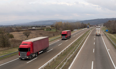 Fototapeta na wymiar Columns of trucks on the road