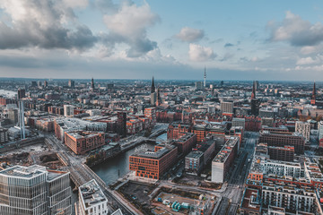 Obraz premium Aerial drone view of Port of Hamburg with clouds over historical city center and sea port