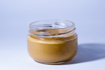 A yellow mustard bottle against a white background with clipping path