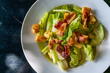 Delicious salad with bacon and biscuits