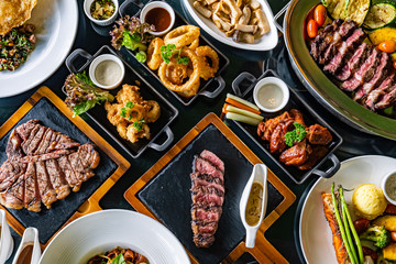 Many fusion dishes on a wooden table
