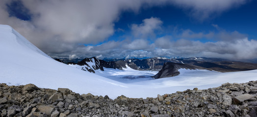 Panorama of mountain landscape as seen from Glittertind mountain eastern slope in Northern direction of Trololsteintjonne glacial lake. Lom, Norway
