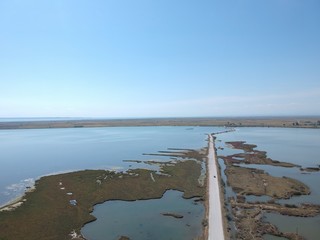 Aerial overhead photo from a drone over a swamp on the delta of Axios river in Thessaloniki/Greece ...