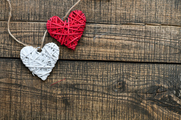 Hearts on a wooden table. Free space - concept for Valentine's Day. Day in love ready background with empty place.