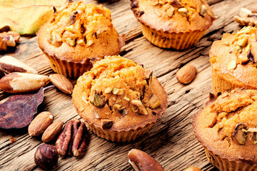 Nut muffins on wooden background