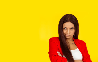Displeased suspicious young woman looking to the side