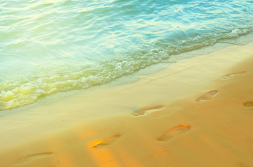Beautiful beach footprints in the sand, view sea