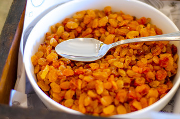 Bowl with raisins grape, organic healthy food, close up