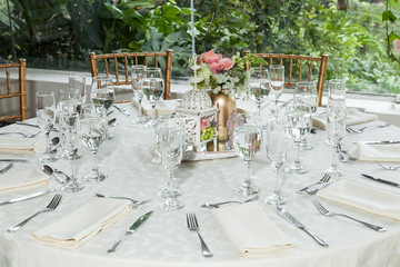 Banquet decorated table, with cutlery. Wedding decor in the banquet hall.