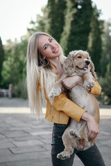 Noise and vintage style. Young girl with dog walks in the park and enjoys the beautiful summer day