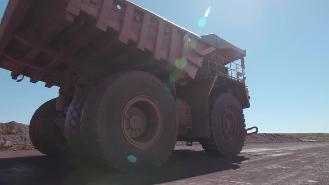 huge mining truck is driving fast in Africa