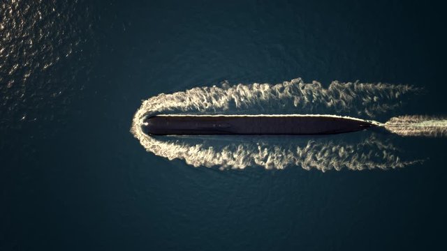 Heavy atomic submarine floating in ocean top view