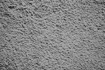 Texture of a concrete wall with cracks and scratches which can be used as a background