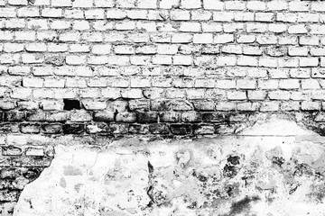Texture of a brick wall with cracks and scratches which can be used as a background