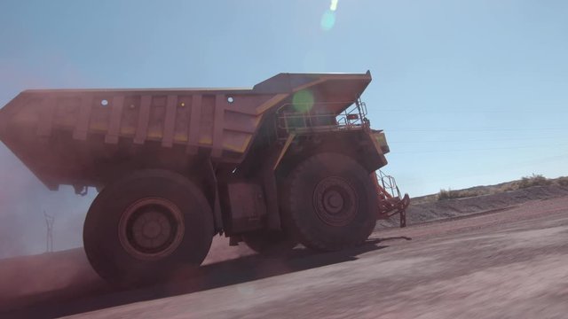 huge mining truck is driving fast in Africa
