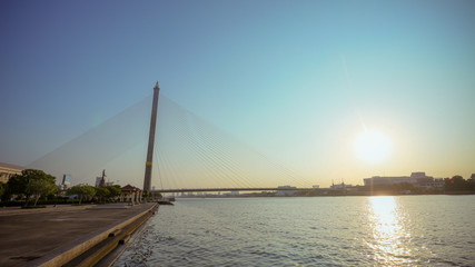 Obraz premium Thailand, Bangkok, view of the Rama VIII Bridge and the Chao Praya river at sunset