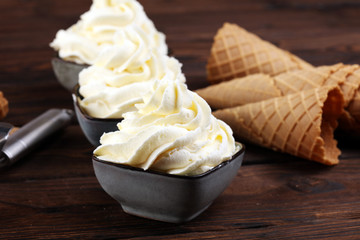 Vanilla soft served ice cream tasty sundae dairy ice cream on rustic background