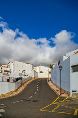 Fototapeta na wymiar Street with typical Canary style holiday apartments