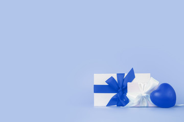 Happy Womens day template design in trendy classic blue color. Decorative gift box with blue bow on blue background.