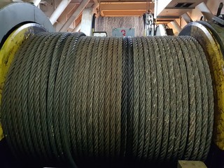 Obraz na płótnie Canvas Wire rope inside a drum of a winch on board a construction work vessel 
