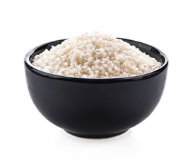 Japanese rice in black bowl on white background