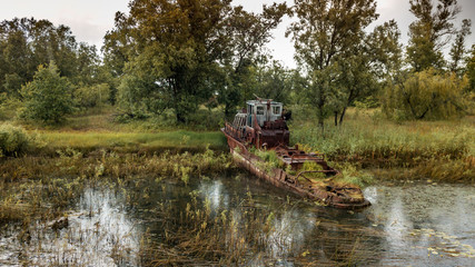 Aerial view abandoned ships in the river near of Chernobyl. The abandoned river port in Pripyat....