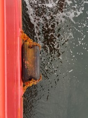 Tyre fender at the side of a construction work boat