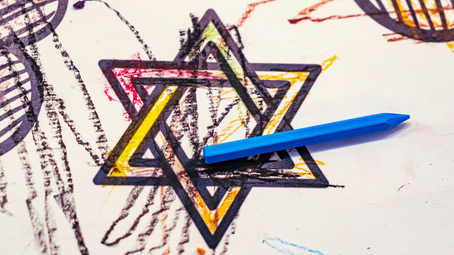 Picture of star of David, magendovid or mogendovid, with the blue pencil. Hannukah and jewish concept and symbol.
