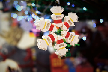 christmas tree decoration made of building blocks in the shape of a snwflake