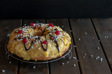 front view of chocolate-dipped Easter thread with cherries and custard