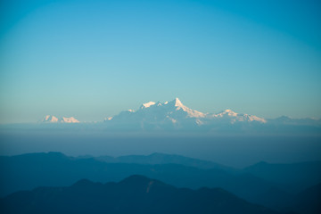 Naklejka na ściany i meble Sunset above mountain in valley Himalayas mountains