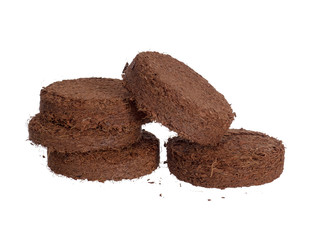 Coir, coconut fibre growing pellets, discs, isolated on white background. Environmentally friendly...