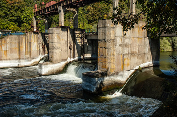 Dam standing on the river restrains a stormy river