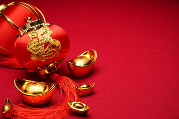 Chinese New Year decorations with red background with assorted festival decorations. Chinese characters means abundant of wealth, prosperity and luck.