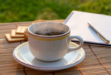 Morning Coffee with Cookie and Notebook